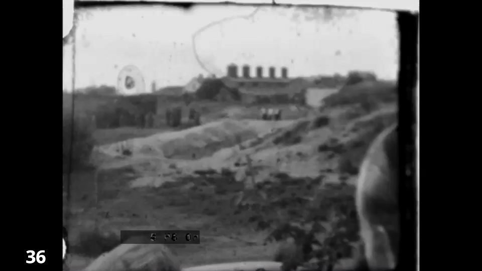 Screenshot from the Wiener Film mass execution in Liepaja 1942 fc 0036 - distant shot from lorry, surrounding bystanders